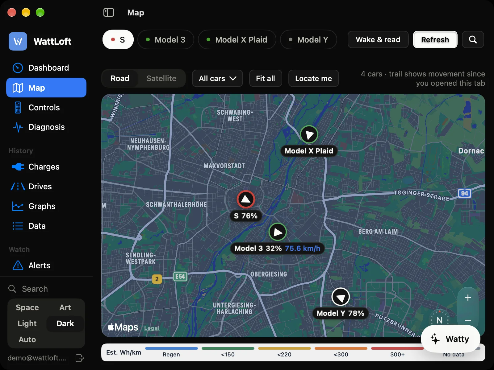 WattLoft for Mac, dark theme: the fleet map with four cars over Munich — S 76%, Model 3 32% at 75.6 km/h, Model X Plaid and Model Y — with heading arrows, labels and the consumption key